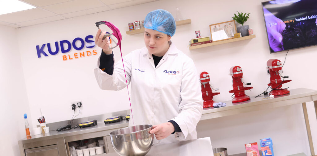 Bakery Technologist observing colourful cake batter for consistency and quality