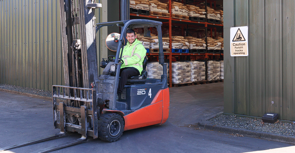 Man on a forklift on a manufacturing site